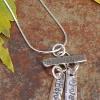 SOLD Fine Silver Stamped Name Tags; hand crafted and  personalized.  Up to 4 tags can be accommodated on this bail.  Great for Mom and Grandmom.  $48 for two tags/chain.  Each additional tag $10.  