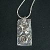Fine silver collage tag pendant.  $75