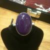 SOLD: This ring is designed using purple jade cabochon approximately 1" in length.  The shank, bezel and base of the ring are fine silver.  Price: $95