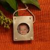 Mother's pendant constructed of fine silver and an inner bezel holding a photo behind a class disk.  SPECIAL ORDER $135.00