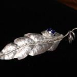 SOLD $125  Fine Silver repousse leaf with tanzanite gemstone in prong setting:  brooch.